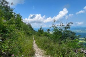Rocky mountain bike trail on Javornik with scenic views across Slovenia