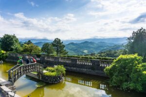 Scenic stone bridge at Štanjel and green Karst landscape on the Trans Slovenia 02 e-bike tour