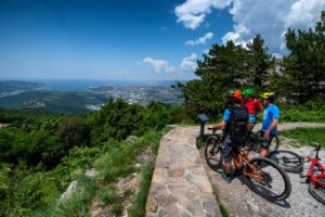 E-bike riders enjoying panoramic coastal views from Socerb on the Trans Slovenia e-bike tour