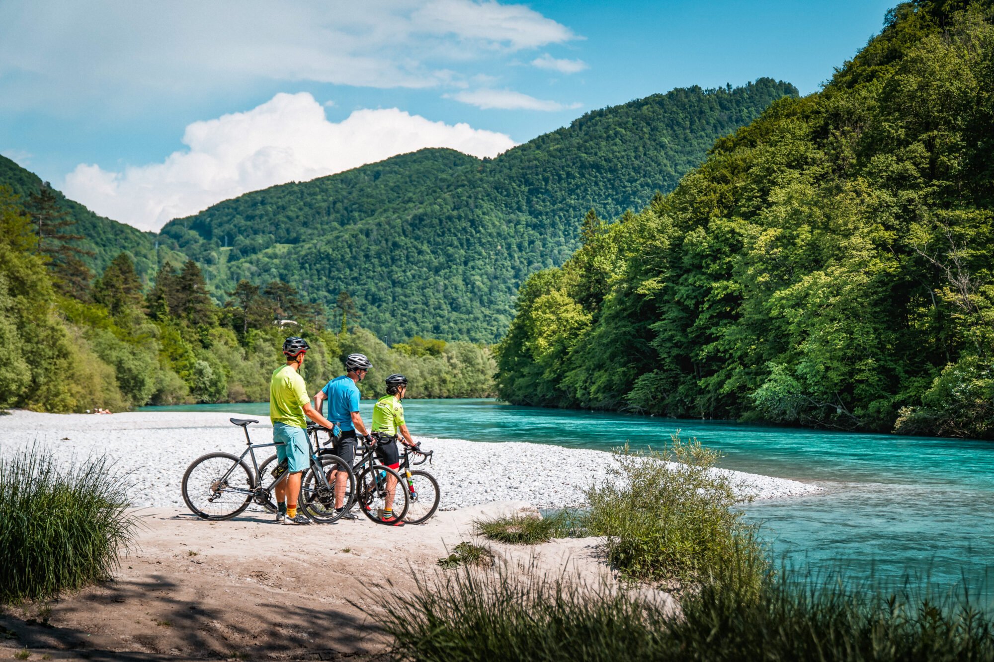 Cyclist by the emerald soča river