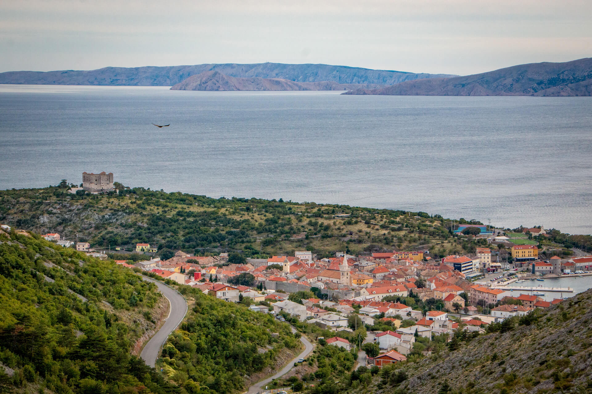 The town of Senj on the Adriatic coast with the Nehaj fortress above it.
