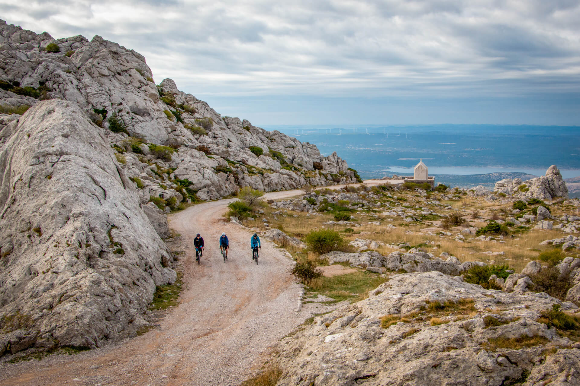 Three cyclists enjoy the Trans Dinarica Gravel Bike Tour in Croatia.
