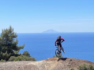 Biker enjoying panoramic sea views during an Elba MTB tour in the Tuscan Archipelago