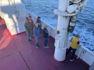 Mountain bikers on the ferry from Piombino to Elba Island crossing the Tyrrhenian Sea